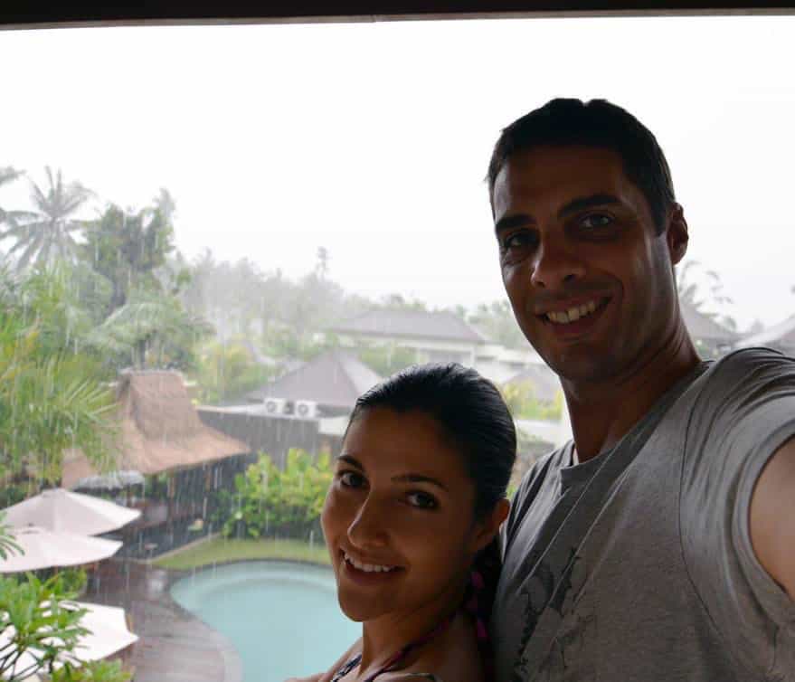 Preya and Med in front of a very rainy backdrop during their engagement weekend in Bali